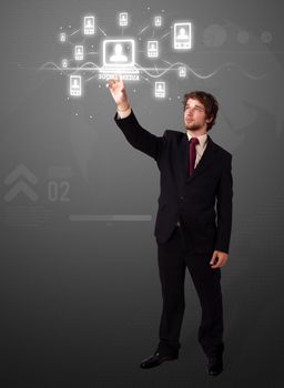 Businessman pressing modern social buttons on a virtual background