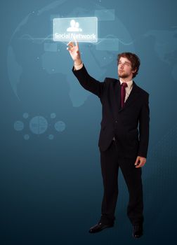 Businessman pressing modern social buttons on a virtual background