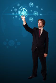 Businessman pressing modern social buttons on a virtual background