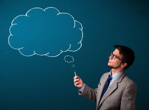 Attractive young man smoking cigarette with idea cloud