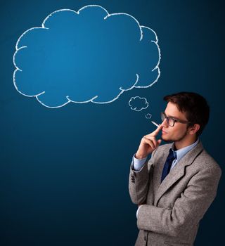 Attractive young man smoking cigarette with idea cloud