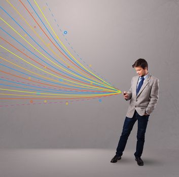 handsome young man holding a phone with colorful abstract lines