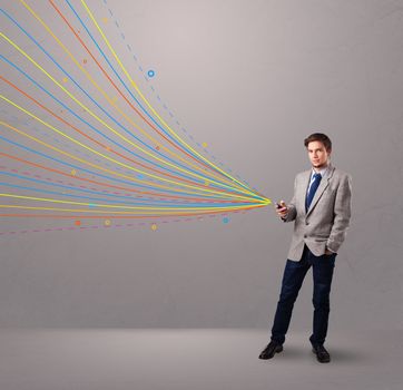 handsome young man holding a phone with colorful abstract lines