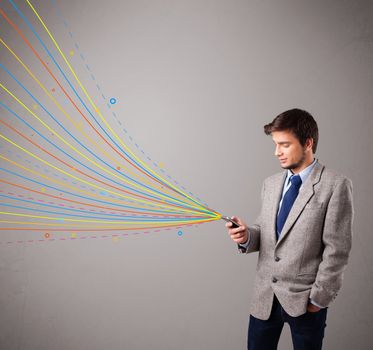 handsome young man holding a phone with colorful abstract lines