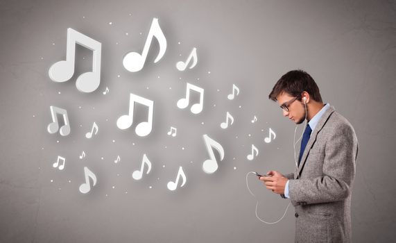 attractive young man singing and listening to music with musical notes getting out of his mouth