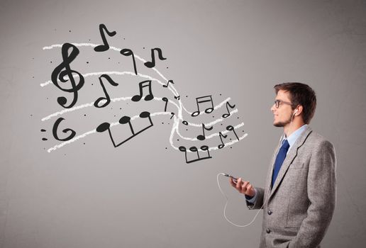 handsome boy singing and listening to music with musical notes getting out og his mouth