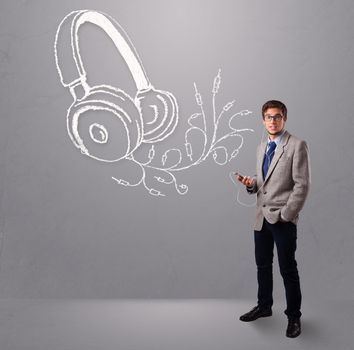 attractive man singing and listening to music with abstract headphone getting out of his mouth