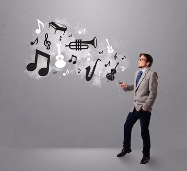 attractive young man singing and listening to music with musical notes and instruments getting out of his mouth