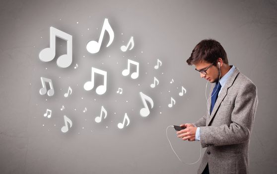 attractive young man singing and listening to music with musical notes getting out of his mouth