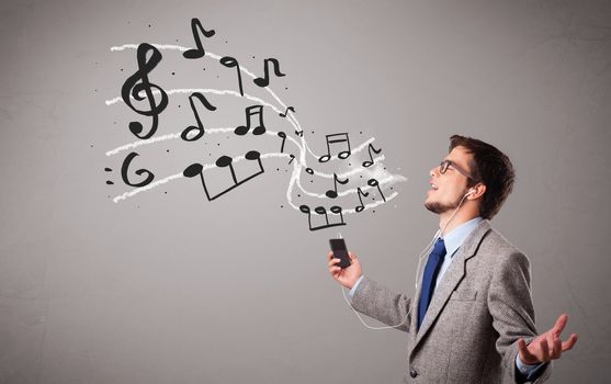 handsome boy singing and listening to music with musical notes getting out og his mouth