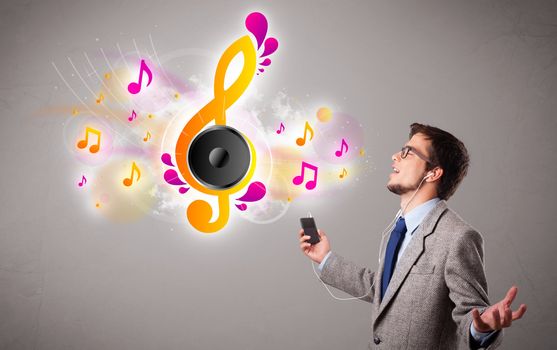 young man singing and listening to music with musical notes getting out of his mouth