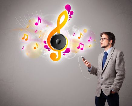 young man singing and listening to music with musical notes getting out of his mouth