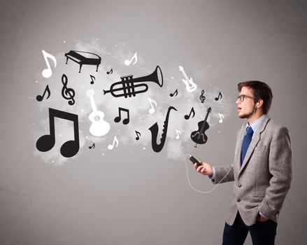 attractive young man singing and listening to music with musical notes and instruments getting out of his mouth