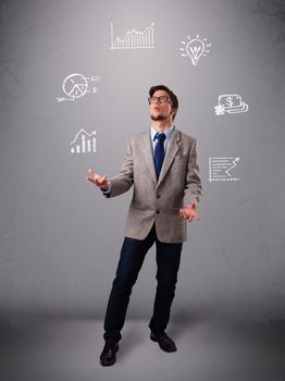 young boy standing and juggling with statistics and graphs