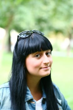 A Fresh Faced Girl With a beautiful face and green background