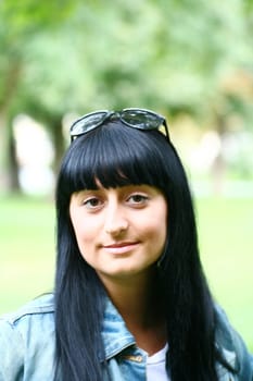 A Fresh Faced Girl With a beautiful face and green background