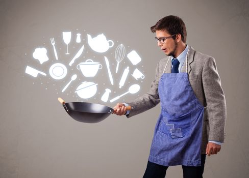 Handsome young man with kitchen accessories icons