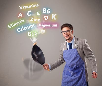 Handsome man cooking vitamins and minerals