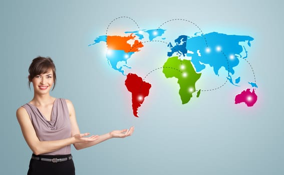 Beautiful young woman presenting colorful world map