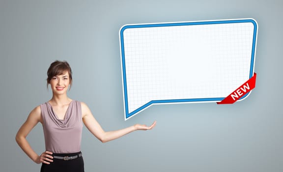 Beautiful young woman presenting modern speech bubble copy space