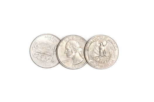 Three American quarters on a white background.