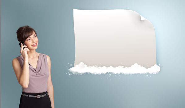 pretty young woman making phone call and presenting modern copy space on clouds