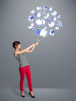 Young pretty woman holding social icon balloon