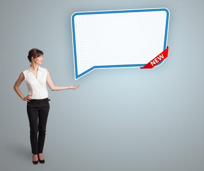 Beautiful young woman presenting modern speech bubble copy space