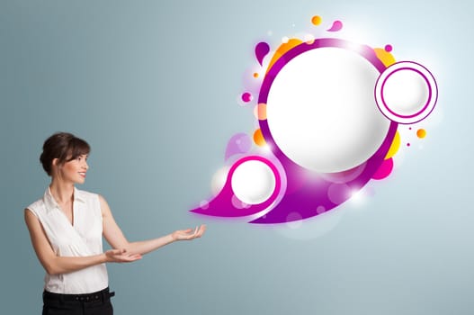 Attractive young woman presenting abstract speech bubble copy space