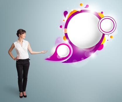 Attractive young woman presenting abstract speech bubble copy space