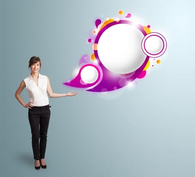 Attractive young woman presenting abstract speech bubble copy space