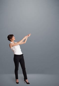 Pretty young lady gesturing with copy space
