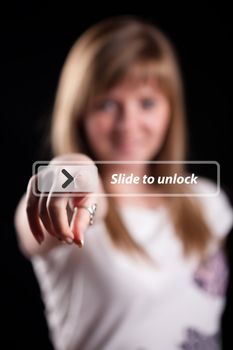 Woman pressing touch screen interface, background in bokeh