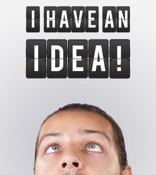 Young persons head looking with gesture at idea type of sign