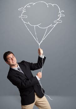 Handsome young man holding cloud balloon drawing