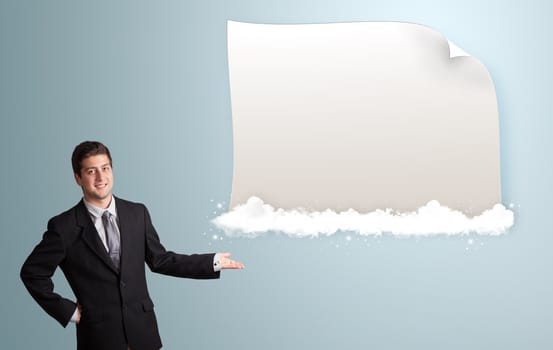 attractive young man presenting modern copy space on clouds