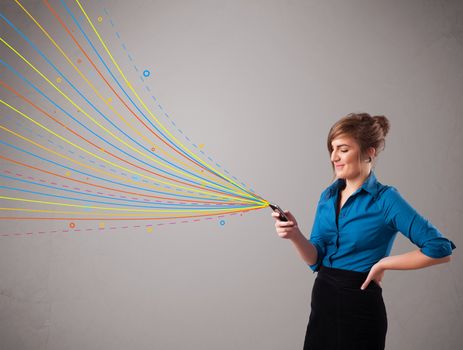 Happy young girl holding a phone with colorful abstract lines