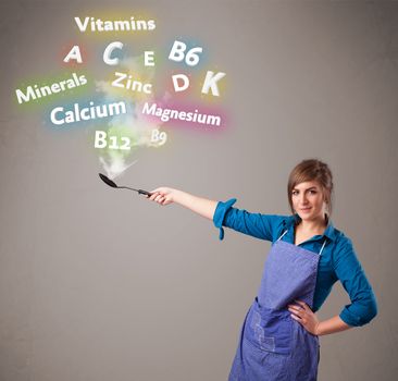 Pretty young woman cooking vitamins and minerals