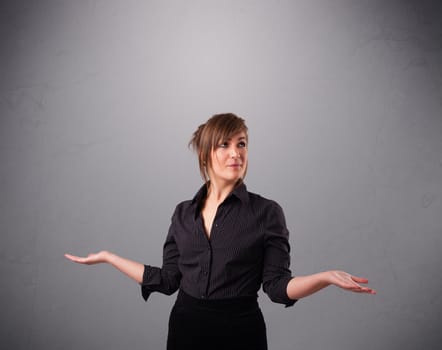 beautiful young lady standing and juggling with copy space