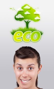 Young girl head looking at green eco sign