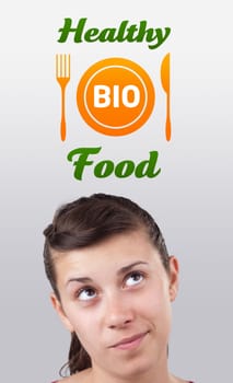 Young girl head looking with gesture at healthy food sign