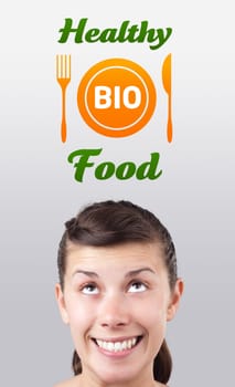 Young girl head looking with gesture at healthy food sign