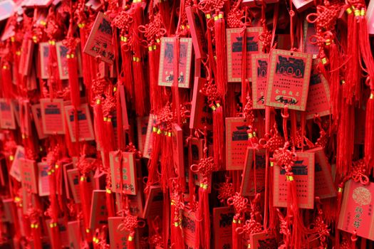 Red Buddhist prayer tablets in Chinese temple
