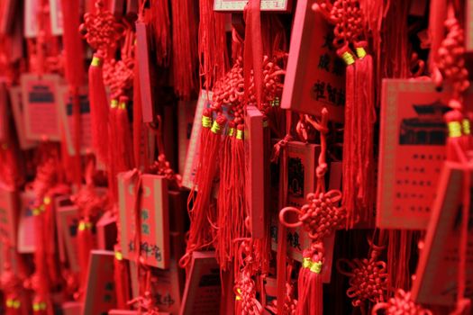 Red Buddhist prayer tablets in Chinese temple
