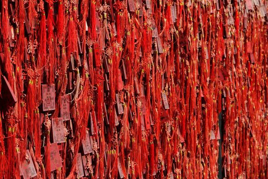 Red Buddhist prayer tablets in Chinese temple
