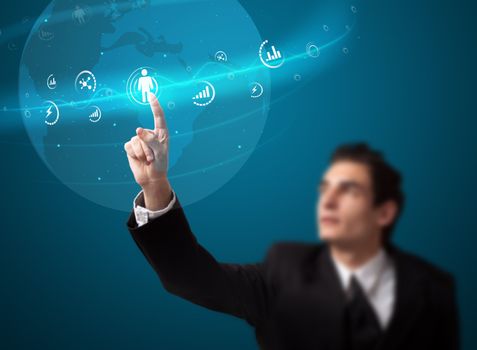 Businessman pressing modern social buttons on a virtual background