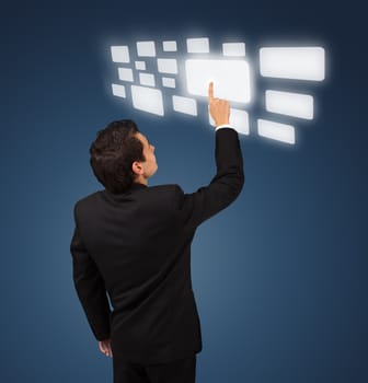 Business man pressing a touchscreen button