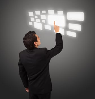 Business man pressing a touchscreen button