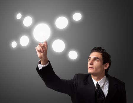 business man pressing a touchscreen button 