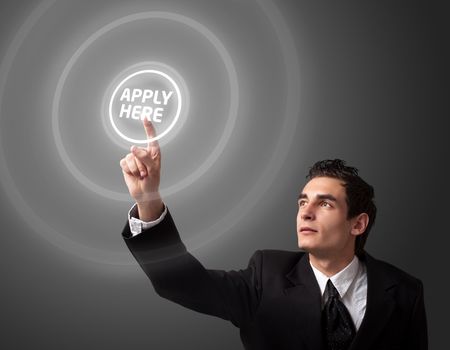 Business man pressing a "Apply HERE" button. 